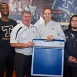 Norman Murphy of Tekscan with the Sports Program Director at Cégep de Thetford and two football players holding the MobileMat.