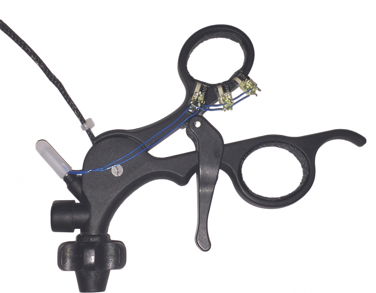 As shown above, three FlexiForce sensors embedded onto the gripper's thumb are used to collect force feedback from the user.