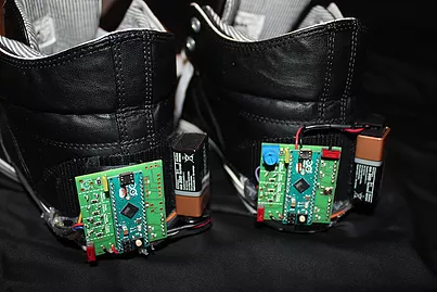 Each shoe is embedded with four FlexiForce sensors, and are connected to Arduino micro controllers. The right shoe is the main controller.